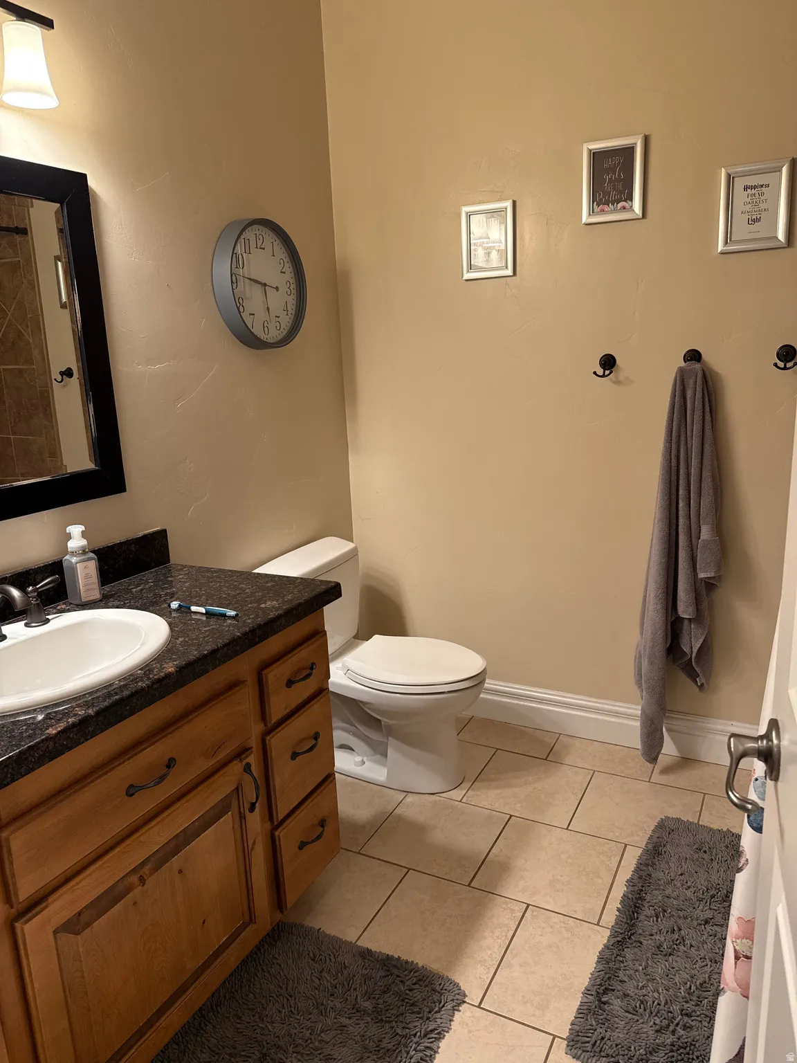 Bathroom featuring vanity and light tile patterned floors