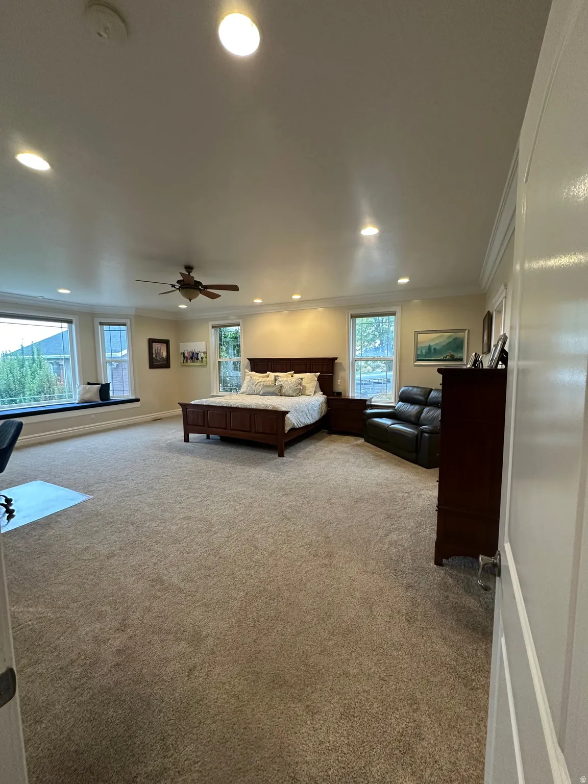 Bedroom featuring light colored carpet, recessed lighting, and crown molding