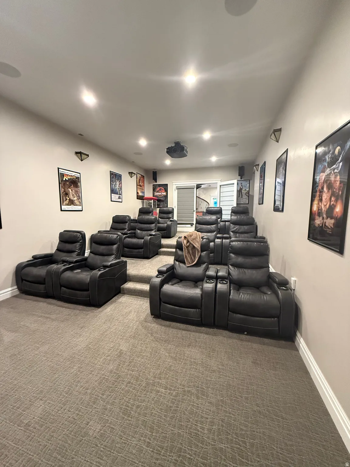 Home theater room with carpet and recessed lighting
