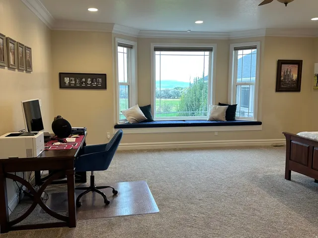 Office featuring light carpet, ceiling fan, ornamental molding, and recessed lighting