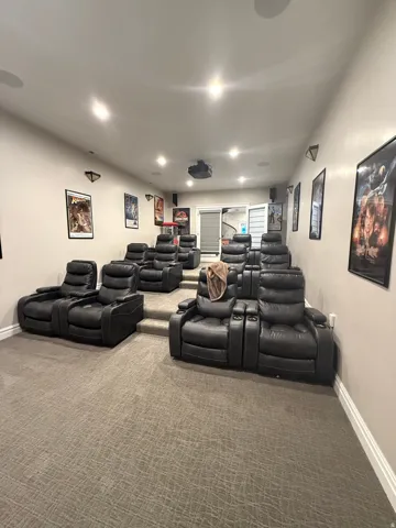 Home theater room with carpet and recessed lighting