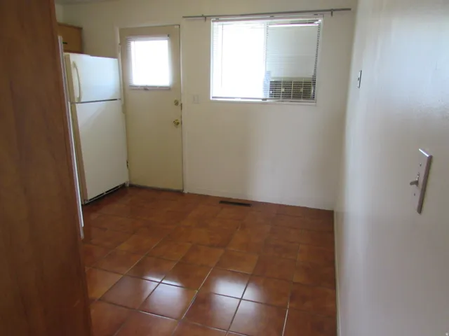 Interior space with dark tile patterned flooring