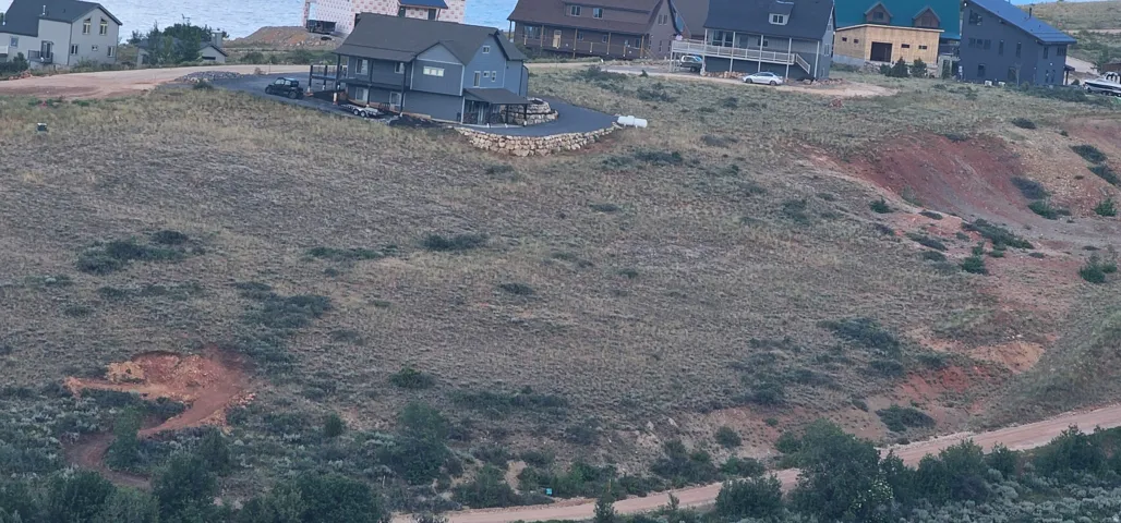 Expansive undeveloped lot featuring varied topography and natural vegetation