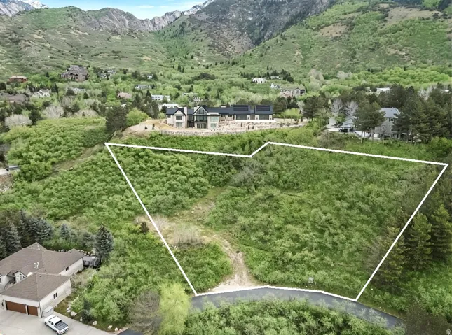 Aerial overview of property's location featuring mountains and property parcel outlined