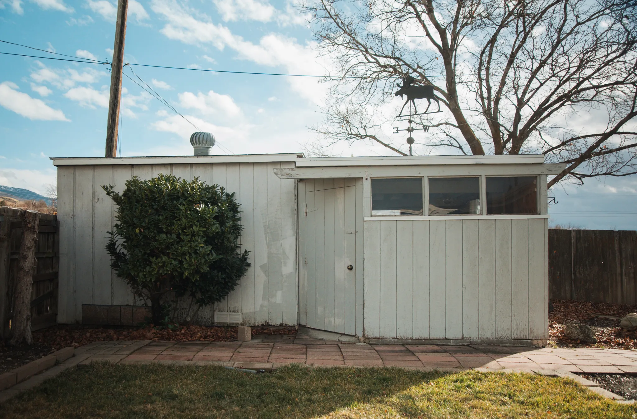 View of shed featuring a fenced backyard