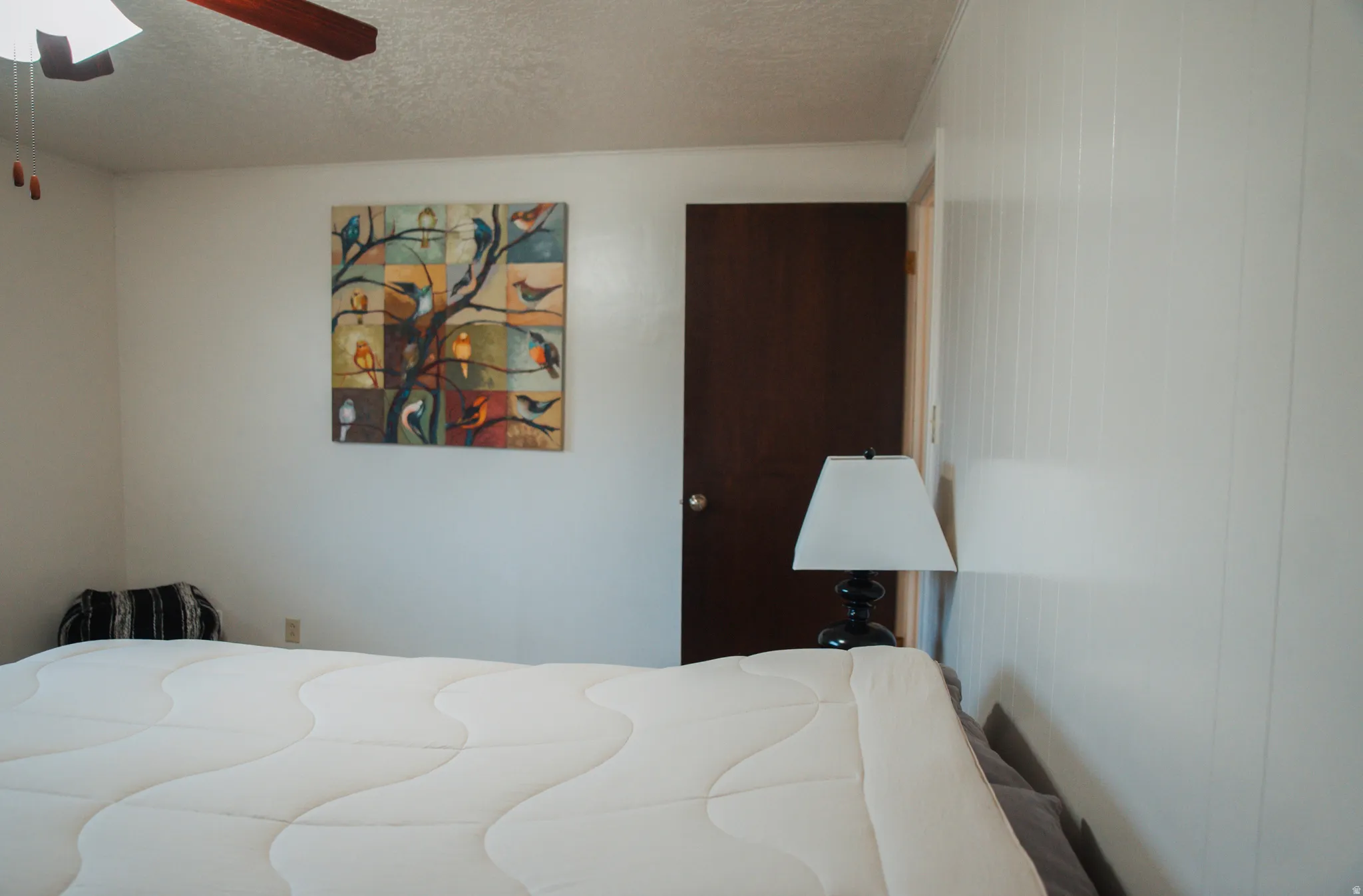 Bedroom featuring a textured ceiling and ceiling fan