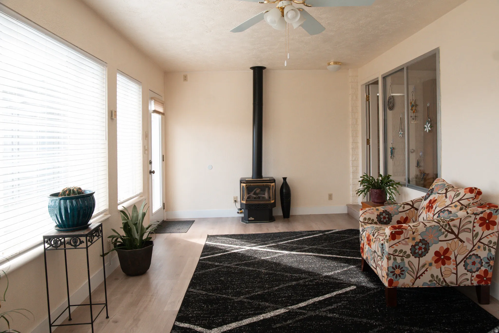 Living area featuring abundant light and Napolean gas fireplace.