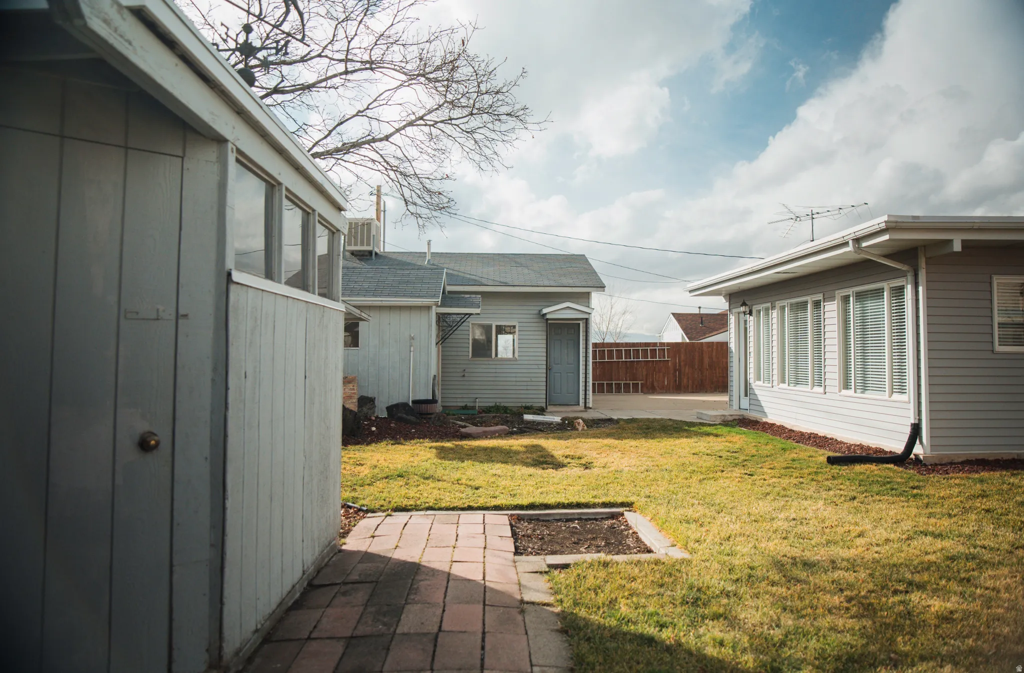 View of yard featuring an outdoor structure and a patio area