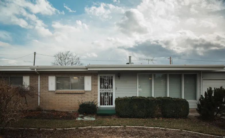 Ranch-style house featuring brick masonry and aluminum siding