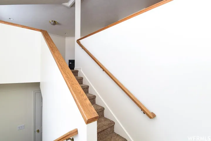 Stairway featuring ornamental molding