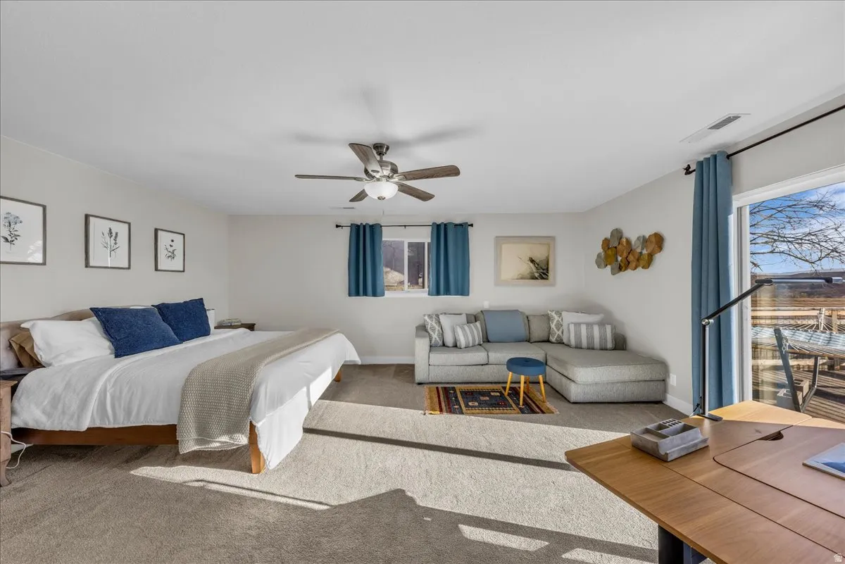 Bedroom featuring carpet floors and ceiling fan