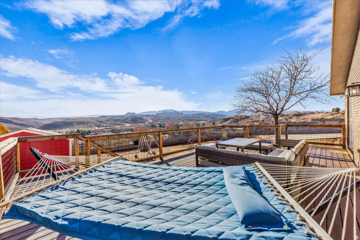 Wooden terrace featuring a mountain view