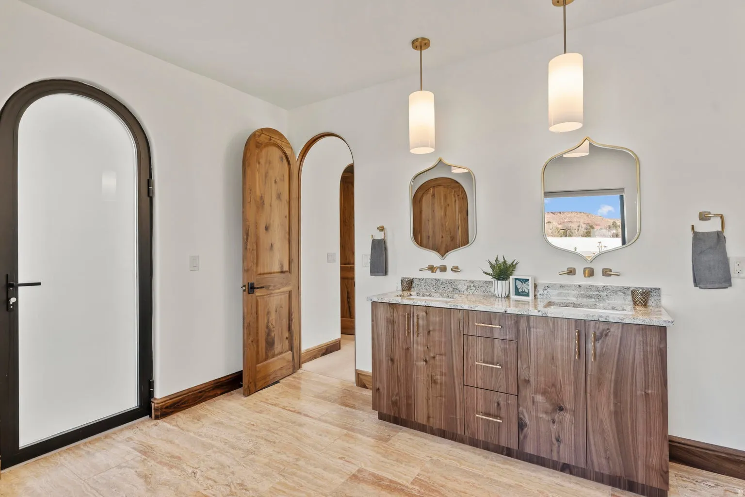Full bathroom featuring double vanity and light wood-type flooring