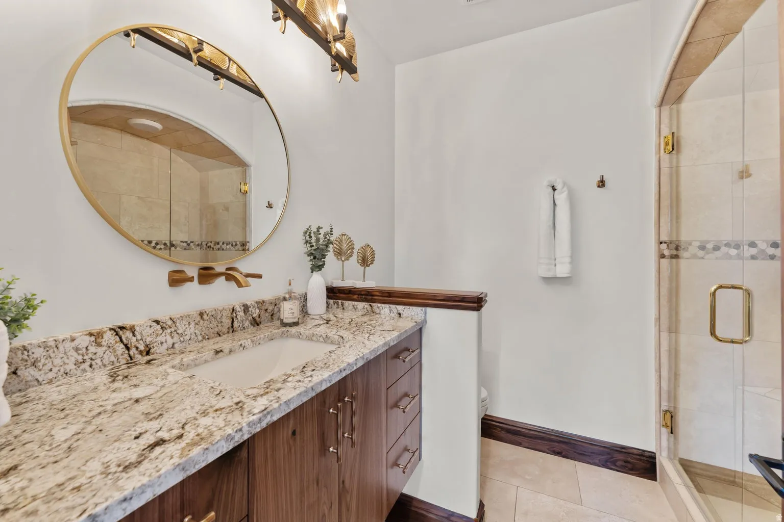 Full Guest bathroom #2 featuring vanity, a shower stall, and light tile patterned floors