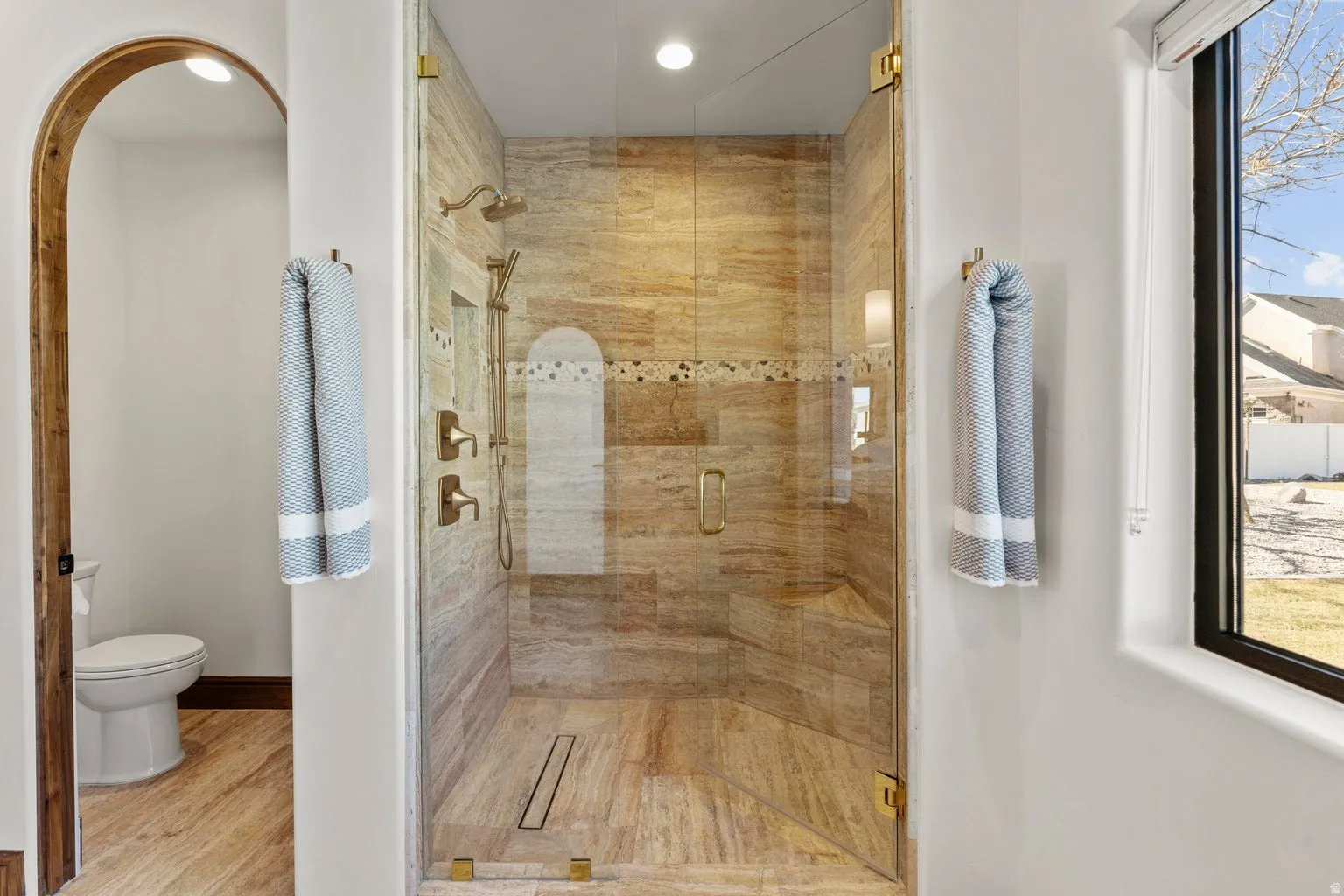 Full bath featuring a shower stall, recessed lighting, and wood finished floors