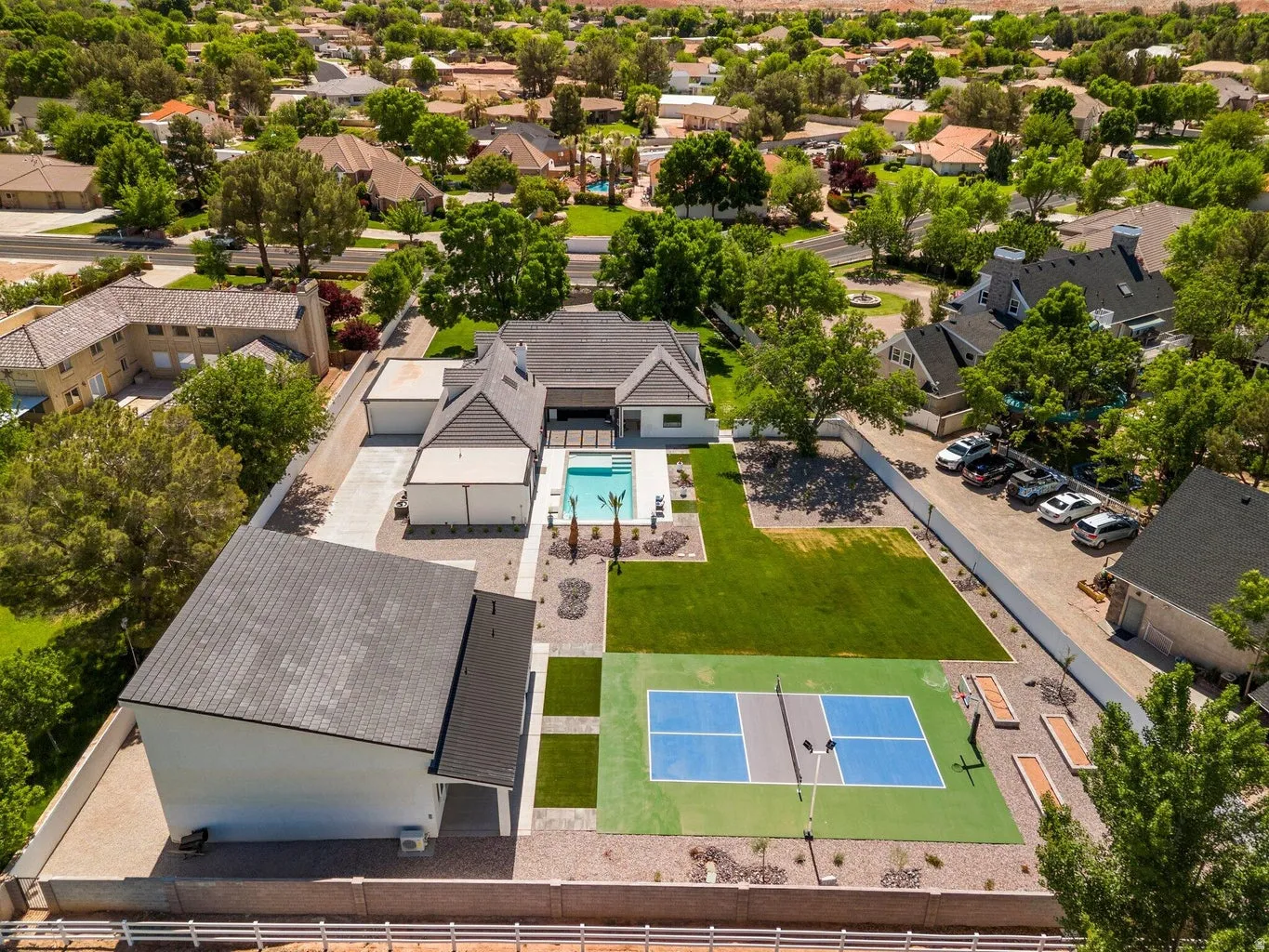 Aerial perspective of suburban area featuring a pool area
