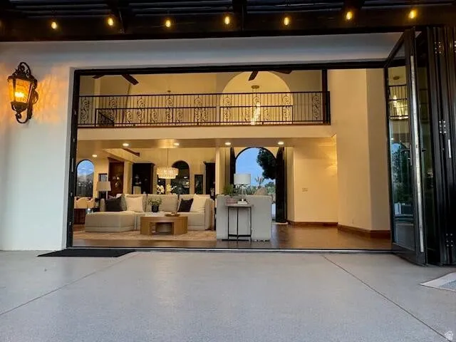 Entrance to property with a patio area and stucco siding