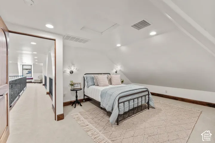 2nd Level Guest Bedroom featuring light carpet, recessed lighting, and lofted ceiling