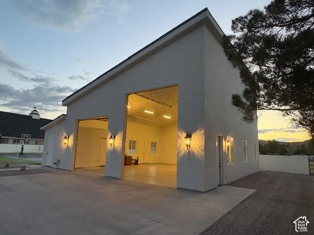 Back of property featuring stucco siding and a patio