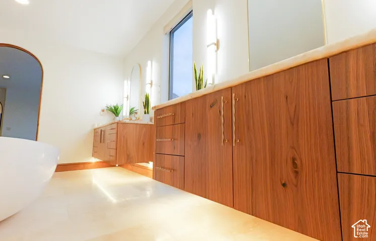 Walnut Floating Cabinets with under mounted LED lighting.