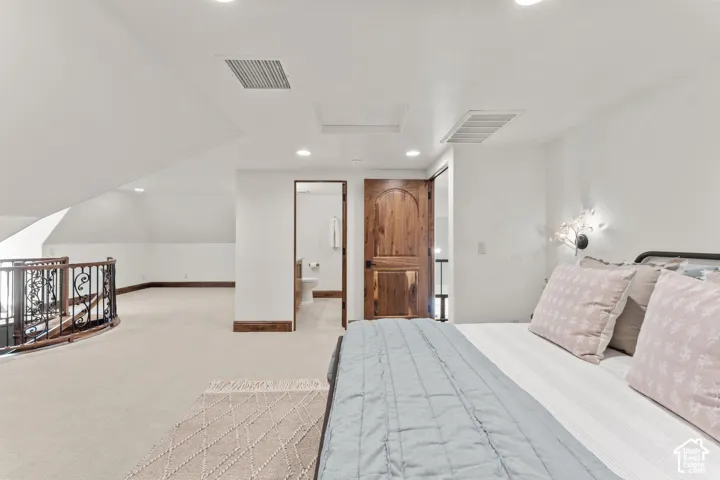 2nd Level Bedroom featuring recessed lighting, light carpet, and ensuite bathroom