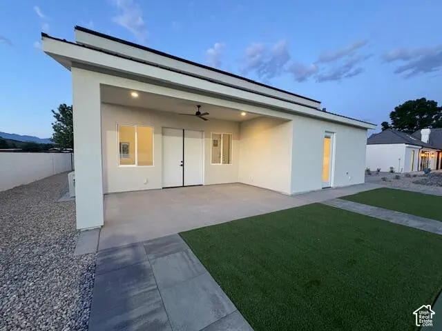 View of side RV Garage with door to the Bathroom and a side patio