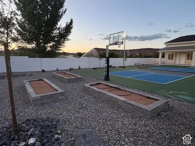 View of basketball court with garden area.