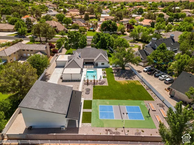Aerial perspective of suburban area featuring a pool area