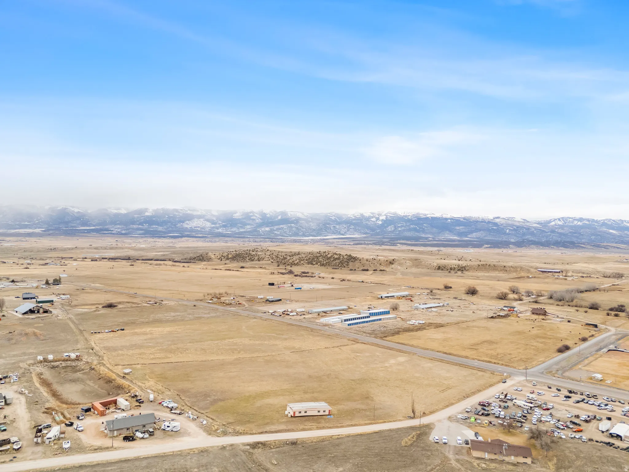 Overview of rural landscape featuring a mountain backdrop