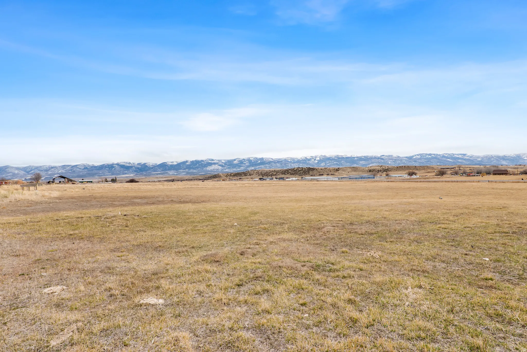 View of mountain backdrop with rural landscape