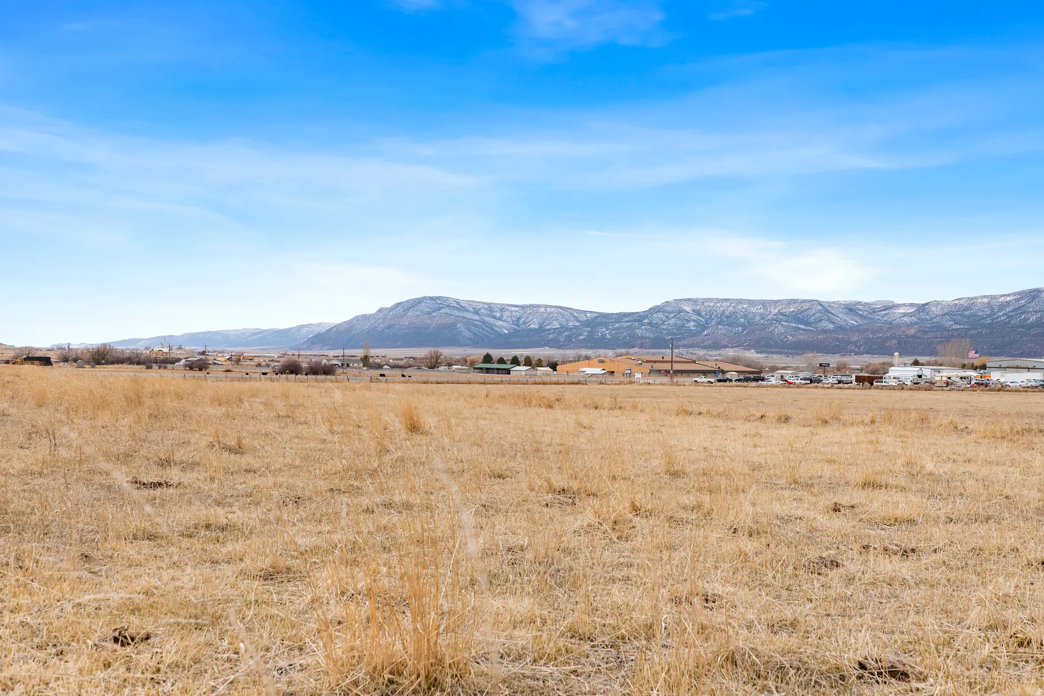 View of mountain backdrop with rural landscape