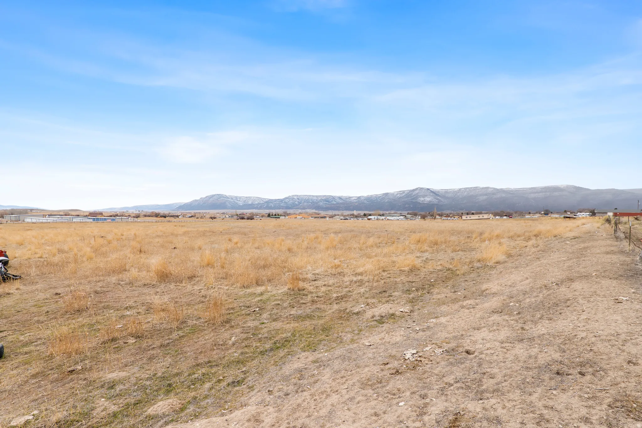 View of mountain backdrop featuring rural landscape