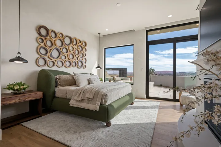 Bedroom featuring light wood-style floors, access to exterior, and recessed lighting