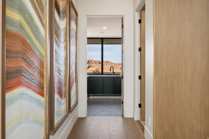 Corridor featuring wood finished floors and recessed lighting