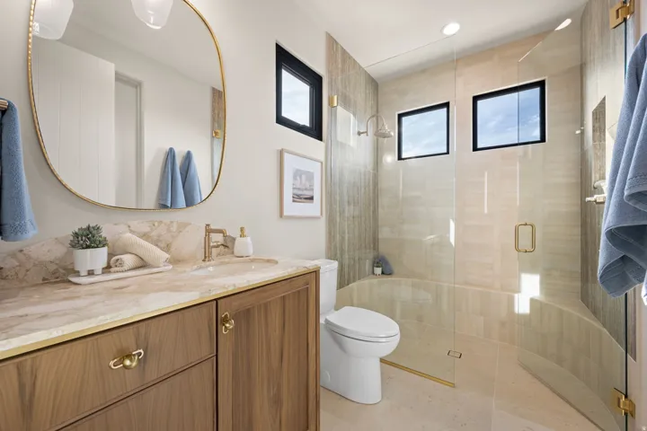 Full bath with a stall shower and vanity