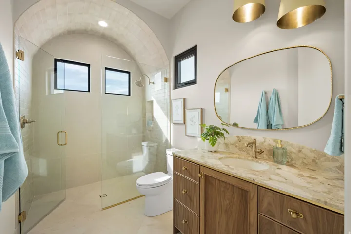 Bathroom with vanity and a stall shower
