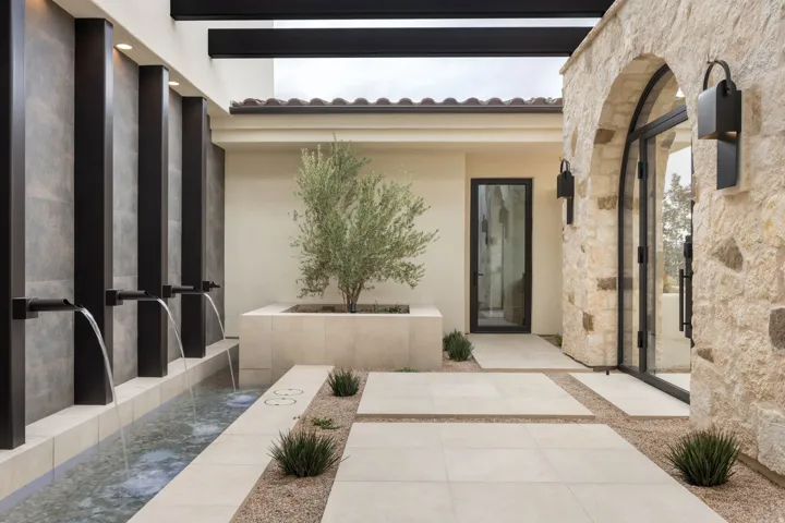 Property entrance featuring stucco siding