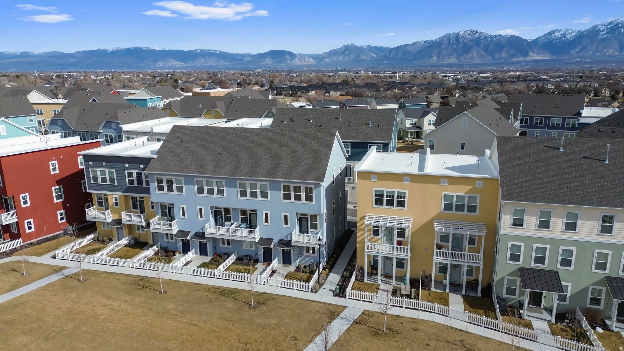 Aerial perspective of suburban area featuring a mountain backdrop