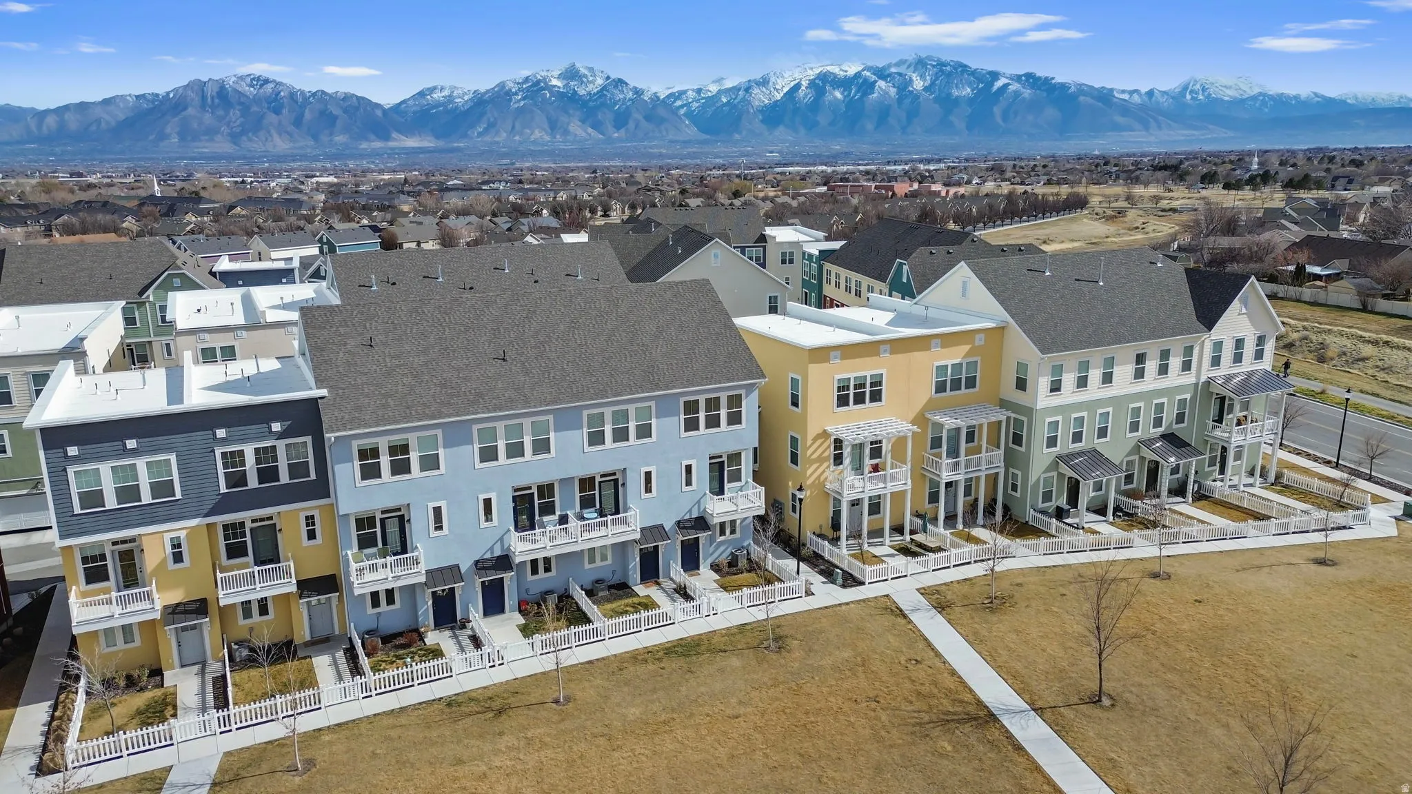 Aerial view of residential area featuring mountains