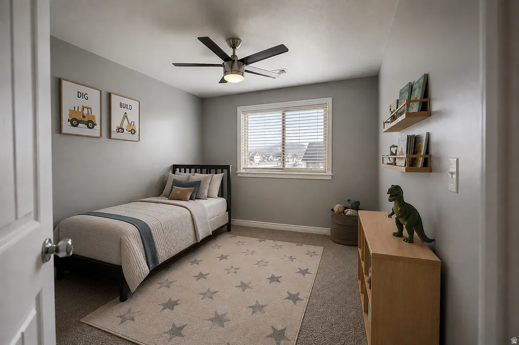 Carpeted room with a ceiling fan light fixture