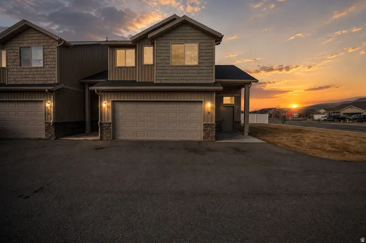 Multi-level exterior with horizontal siding and shingle accents