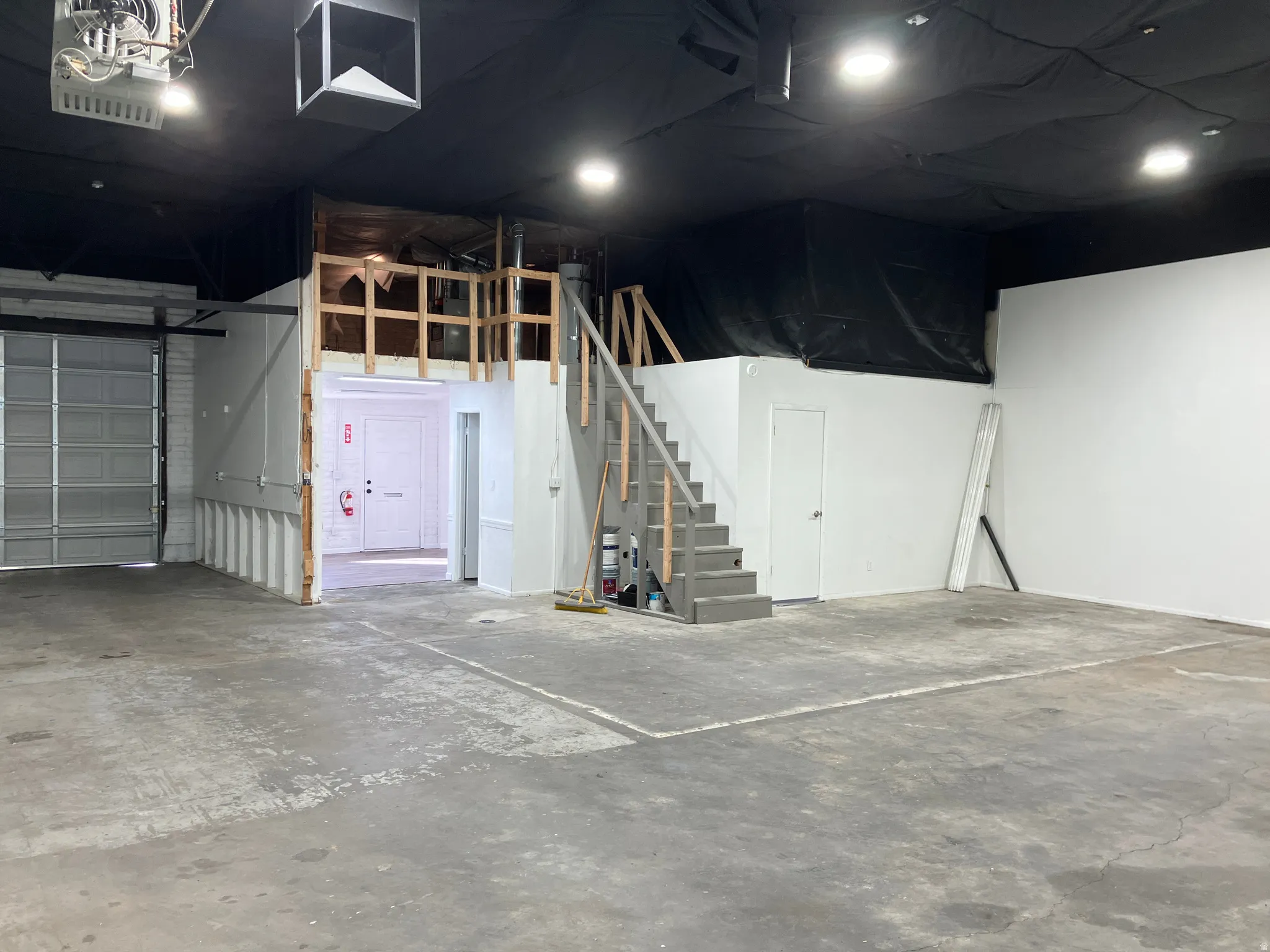 Garage featuring a garage door opener