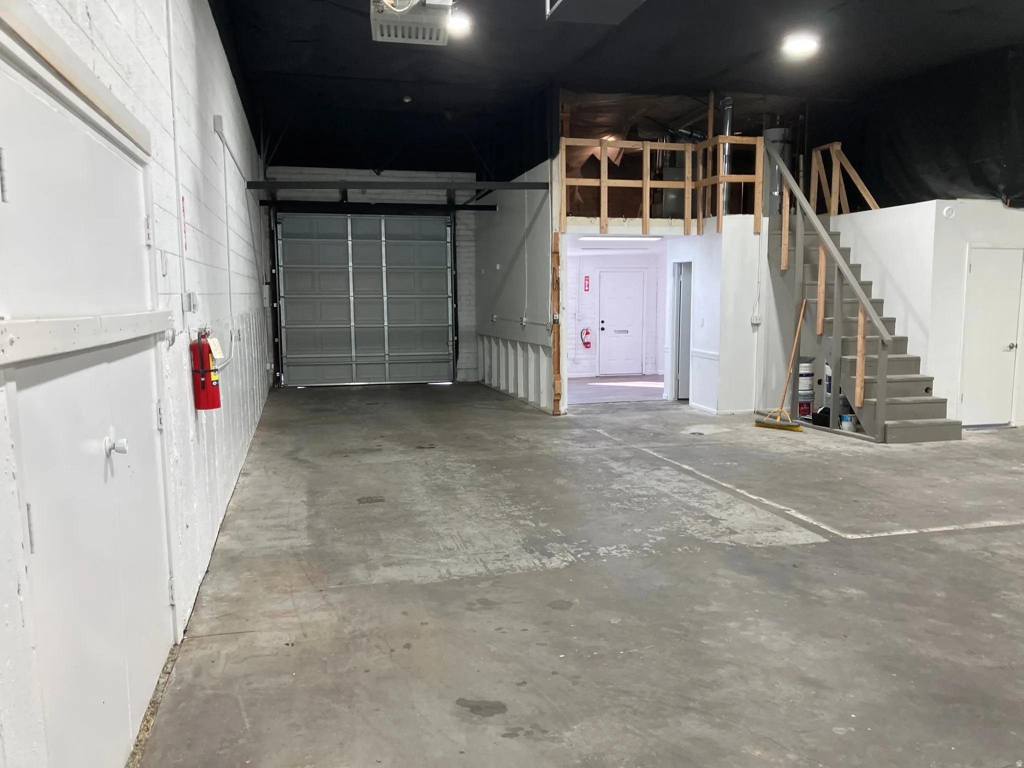 Garage featuring a garage door opener