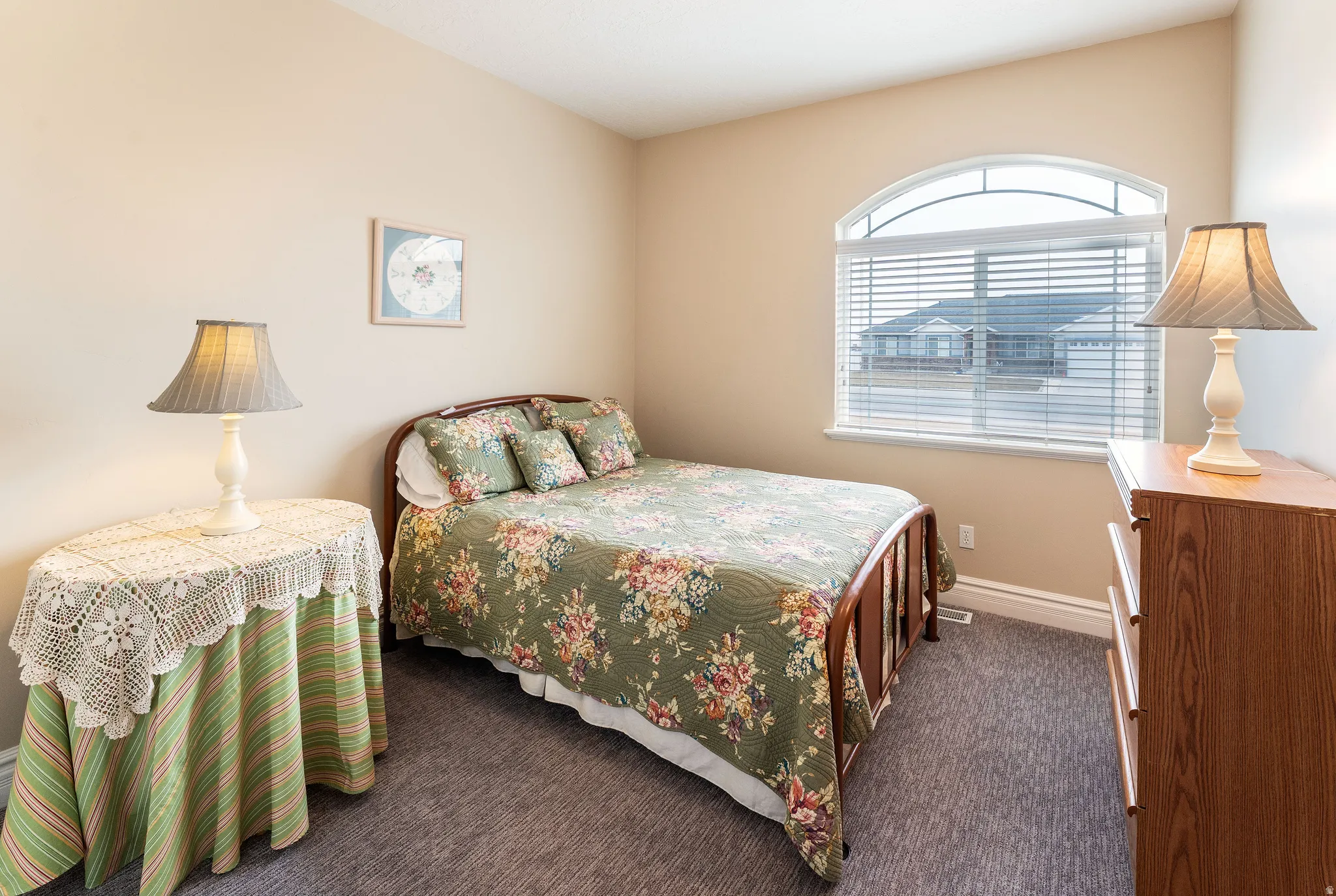 Bedroom featuring carpet floors and baseboards