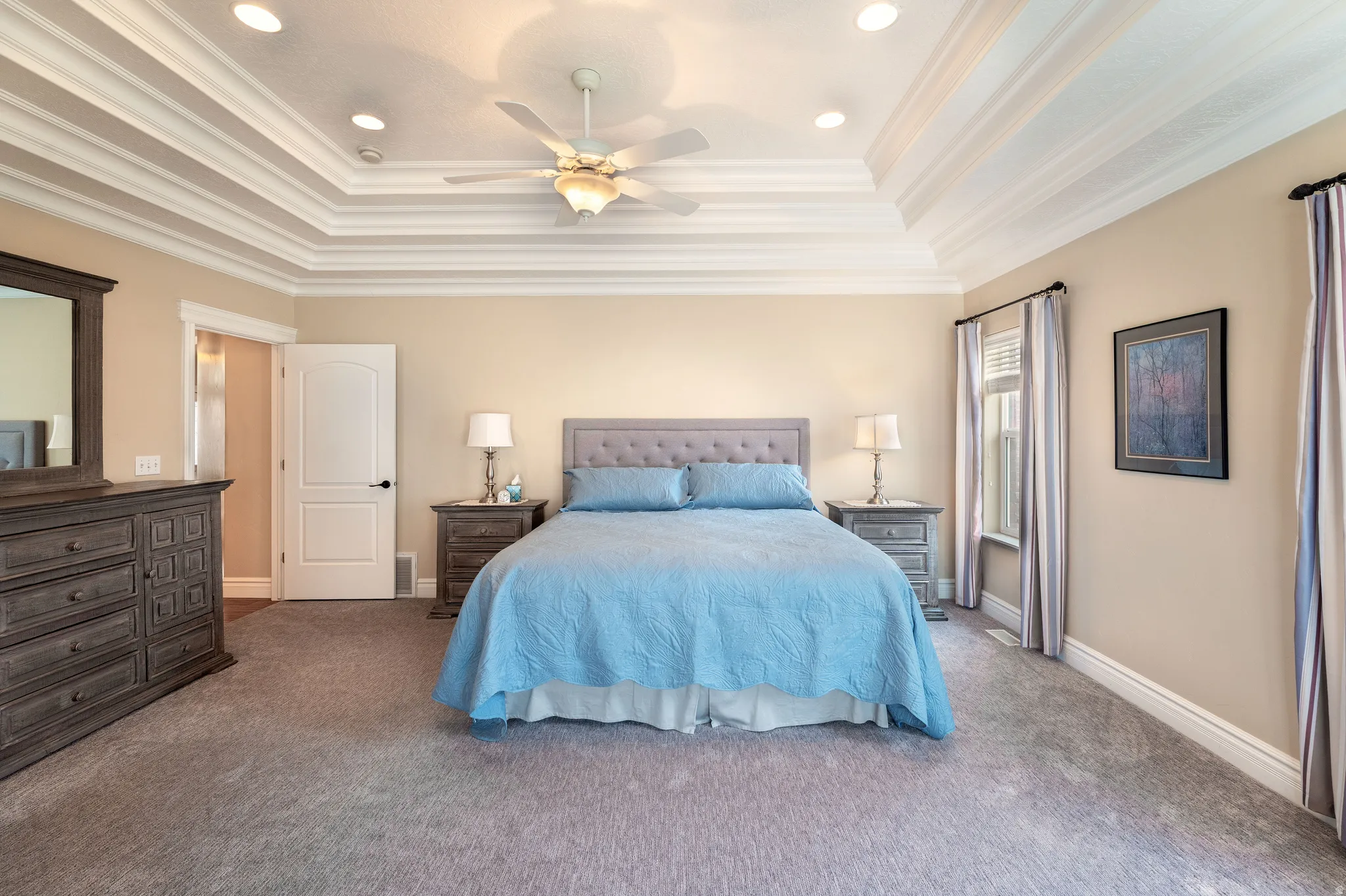 Bedroom with ceiling fan, carpet floors, recessed lighting, and ornamental molding