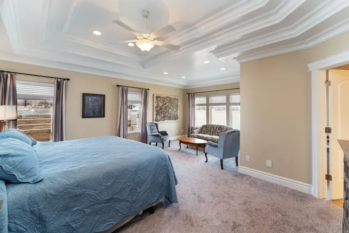 Bedroom with ceiling fan, carpet floors, recessed lighting, and ornamental molding
