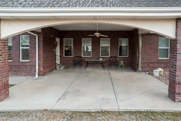 View of patio featuring a ceiling fan