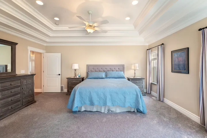 Bedroom with ceiling fan, carpet floors, recessed lighting, and ornamental molding