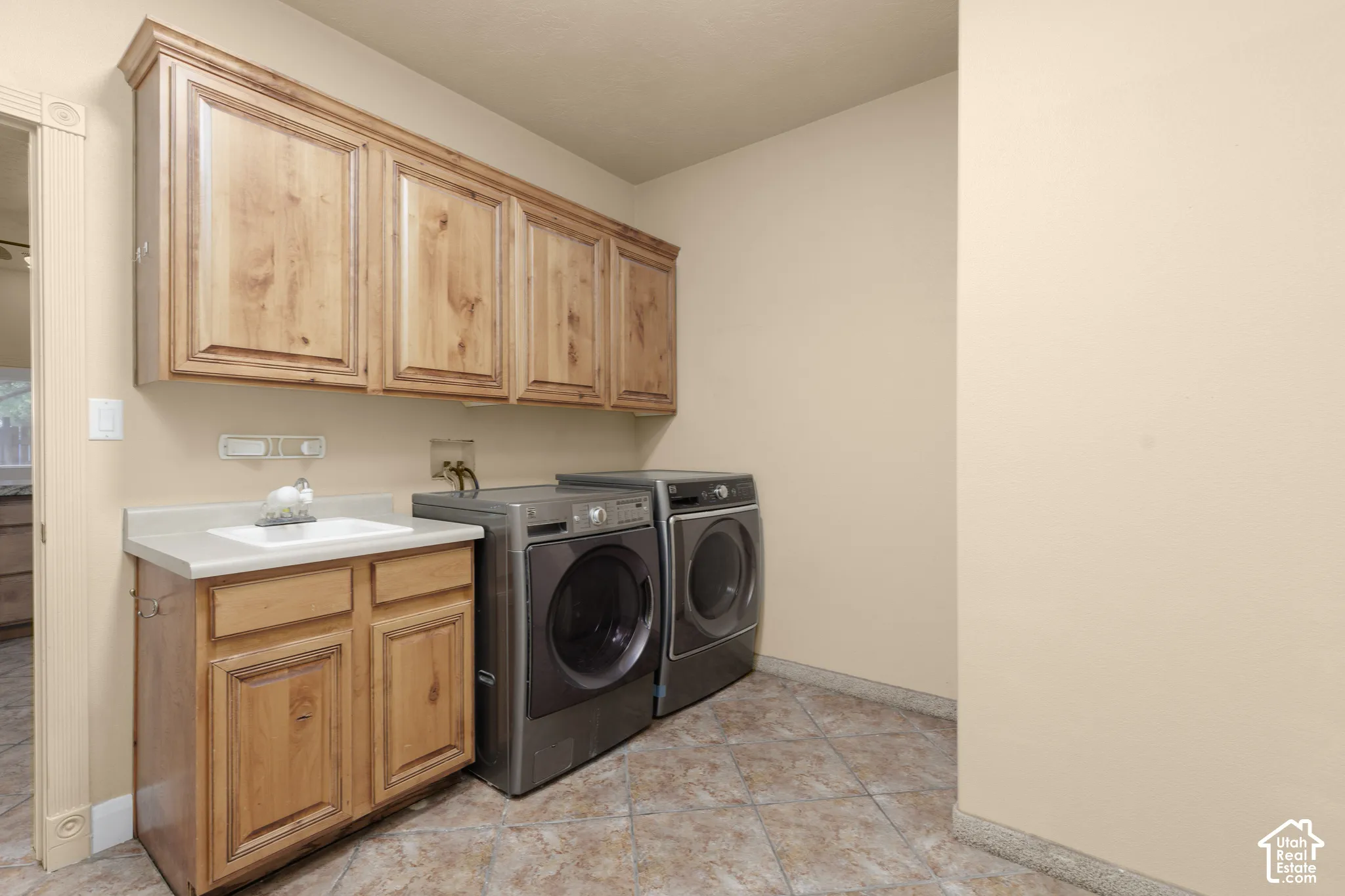 Laundry room with washer/dryer and sink