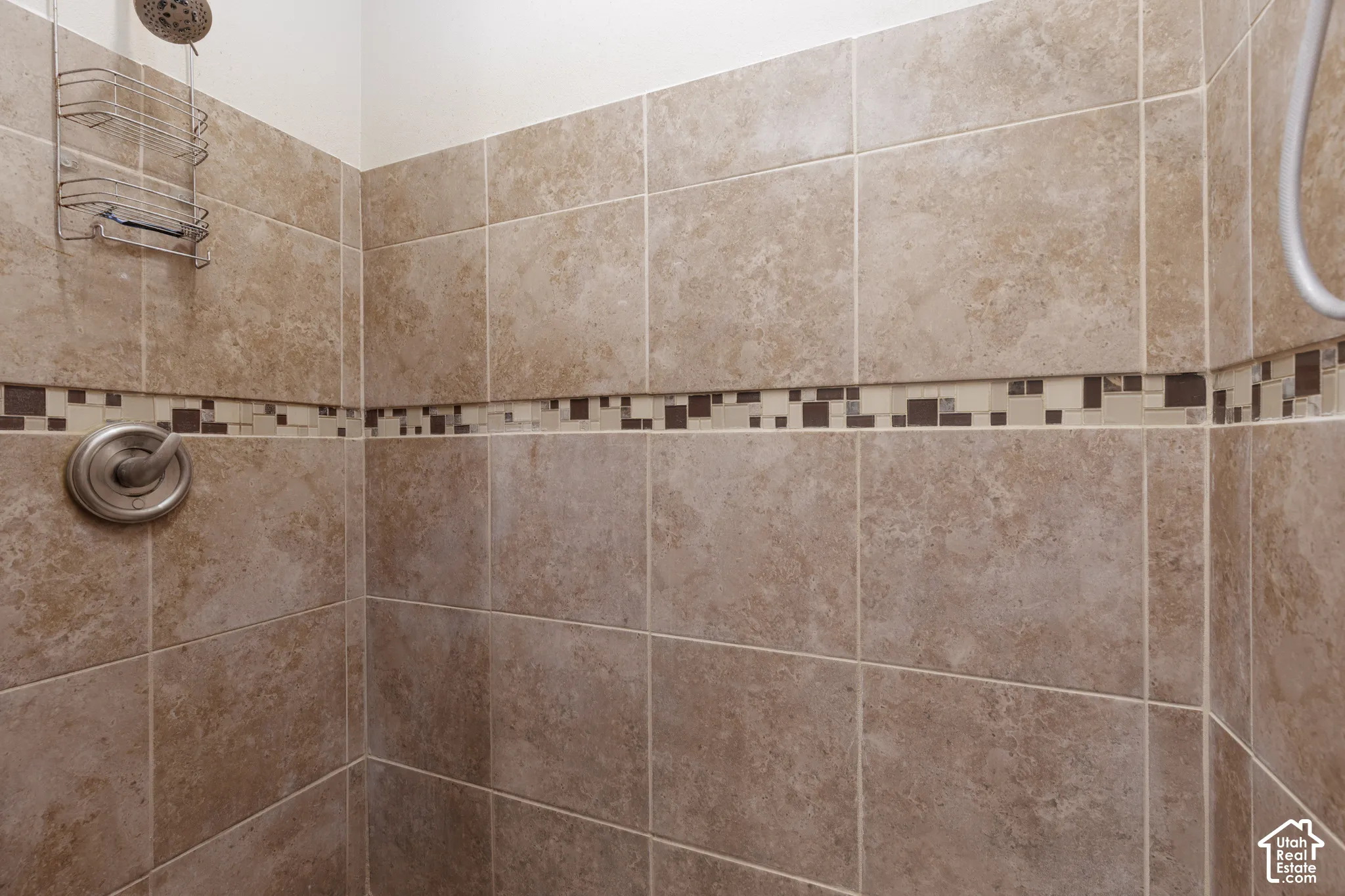 Primary bathroom view of a tile shower